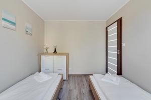 Posteľ alebo postele v izbe v ubytovaní Comfort Apartments Gdynia Centrum