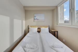 Posteľ alebo postele v izbe v ubytovaní Comfort Apartments Gdynia Centrum