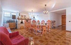 a living room with a table and chairs and a fireplace at 2 Bedroom Nice Apartment In Vodnjan in Vodnjan