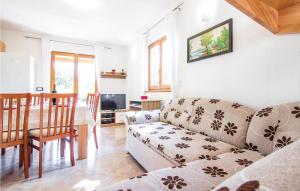 a living room with a couch and a table at 4 Bedroom Beautiful Home In Laginji in Žminj
