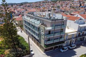 an overhead view of a building with cars parked on a street at Mouikis Hotel Kefalonia in Argostoli