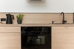 Kuchyň nebo kuchyňský kout v ubytování Apartament Amelia Q4Apartments