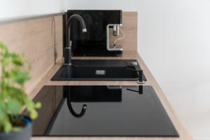 Kuchyň nebo kuchyňský kout v ubytování Apartament Amelia Q4Apartments