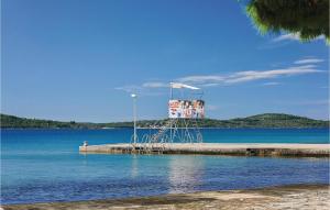 a dock in the middle of a body of water at Two-Bedroom Apartment In Jadrija in Jadrija