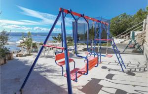 Children's play area sa Nice Apartment In Mimice With Outdoor Swimming Pool