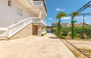 a house with a staircase on the side of it at Lovely Apartment In Vodice With Wifi in Vodice
