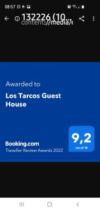 een schermafdruk van een telefoonscherm met avertisement voor bij Los Tarcos Guest House in San Salvador de Jujuy