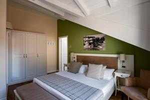Voodi või voodid majutusasutuse Hotel Garni Corona toas