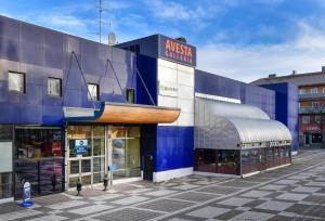 a store front of a blue building at Best Western Nya Star Hotel in Avesta