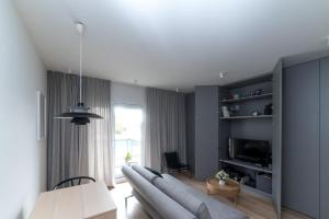 TV a/nebo společenská místnost v ubytování Apartament Amelia Q4Apartments