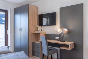 TV a/nebo společenská místnost v ubytování Comfort Apartment Buchhorn