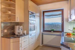 A kitchen or kitchenette at Comfort Apartment Buchhorn