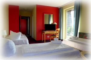 Ένα ή περισσότερα κρεβάτια σε δωμάτιο στο Hotel Lindenberger Hof