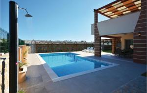 a swimming pool on the roof of a house at Gorgeous Home In Solin in Solin