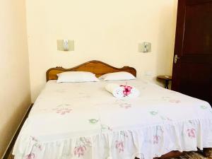 Ένα ή περισσότερα κρεβάτια σε δωμάτιο στο Gihan villa