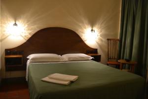 Postel nebo postele na pokoji v ubytování Hotel Al SanPietrino