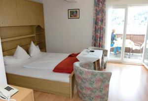 Een bed of bedden in een kamer bij Strandhotel Pichler