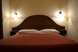 Postel nebo postele na pokoji v ubytování Hotel Al SanPietrino