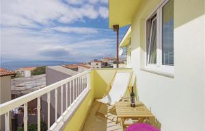 a balcony with a table and a window at Beautiful Apartment In Makarska With House Sea View in Makarska