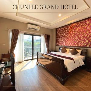 מיטה או מיטות בחדר ב-Chunlee Grand Korat