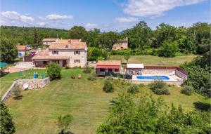 an aerial view of a house with a swimming pool at Gorgeous Home In Labin With Outdoor Swimming Pool in Labin