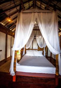 Кровать или кровати в номере Pousada Sabambugi