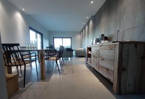 a dining room with a table and chairs at Balneario de Calabor in Calabor