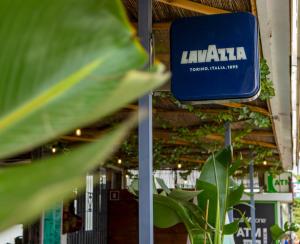 a sign for aphaiautics trial shop with plants at Tabbu ibiza apartments in Playa d'en Bossa