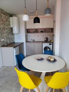 A kitchen or kitchenette at Obzor Tatyana Apartments The Wave