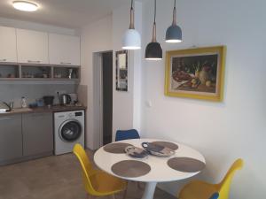 A kitchen or kitchenette at Obzor Tatyana Apartments The Wave