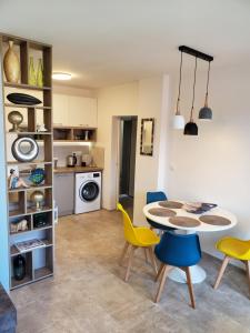 A kitchen or kitchenette at Obzor Tatyana Apartments The Wave
