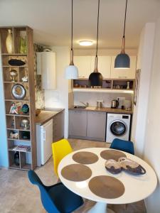 A kitchen or kitchenette at Obzor Tatyana Apartments The Wave