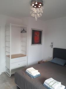 A bed or beds in a room at Obzor Tatyana Apartments The Wave
