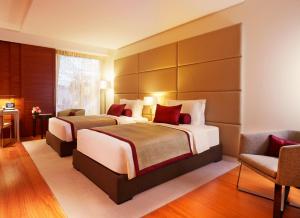 Tempat tidur dalam kamar di Oryx Airport Hotel -Transit Only