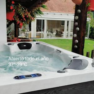 a jacuzzi tub in the backyard of a house at El Atico de Villalmar in Tui