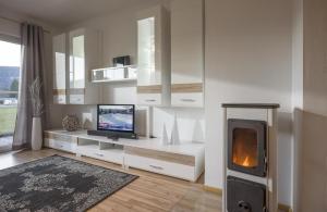TV a/nebo společenská místnost v ubytování Appartement Raffael