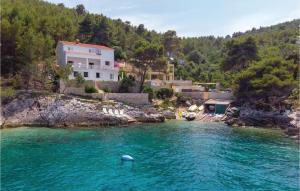 a house on a hill next to a body of water at Amazing Home In Blato With Wifi in Blato +40 photos