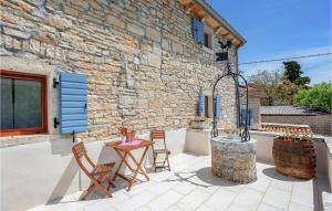 Patio alebo iná vonkajšia časť ubytovania Holiday Home Pamici V
