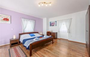 Posteľ alebo postele v izbe v ubytovaní Holiday Home Pamici V