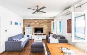 a living room with two couches and a tv at Amazing Home In Brist With Kitchen in Brist