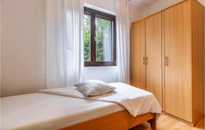 Postel nebo postele na pokoji v ubytování Apartment Fazana Lxxvi