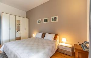 Postel nebo postele na pokoji v ubytování Apartment Fazana Lxxvi