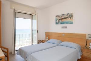 Voodi või voodid majutusasutuse Albergo La Sirenella toas