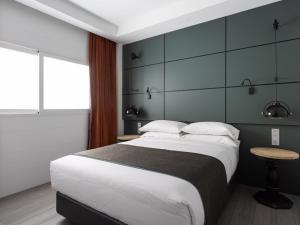Postel nebo postele na pokoji v ubytování PillowAbroad - Médano A