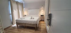 Postel nebo postele na pokoji v ubytování Hostal La Ermita