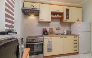 A kitchen or kitchenette at Amazing Apartment In Rabac With Wifi