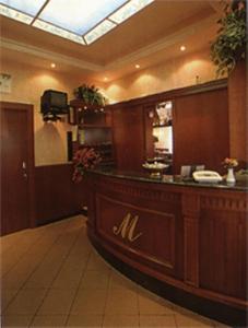 a restaurant with a bar in a room at Hotel La Maddalena in Quattro Castella