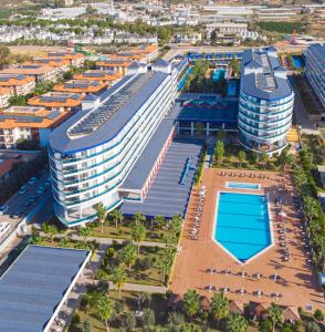 an aerial view of a large building with a swimming pool at Eftalia Marin Resort in Konaklı
