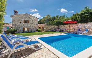 an external view of a villa with a swimming pool at Nice Home In Regulici With 3 Bedrooms, Wifi And Outdoor Swimming Pool in Prnjani