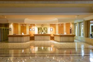 a lobby of a hotel with two reception desks at Cap Bon Kelibia Beach Hotel & Spa in Kelibia +100 photos